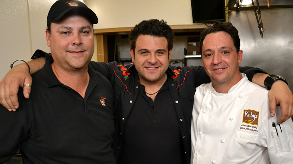Adam with chef Will Christopher (right) and another staff member at Kuby's Sausage House